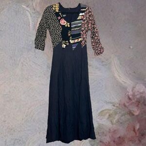 Black and multi-coloured floral patchwork midi dress. 3/4 sleeve. Zips in back